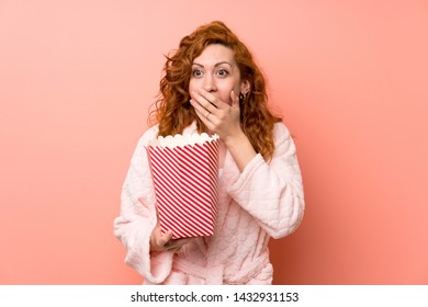 Redhead Woman In Dressing Gown Eating Popcorns