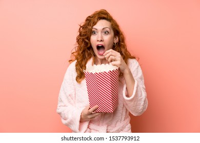 Redhead Woman In Dressing Gown Eating Popcorns