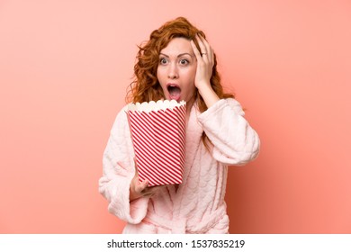 Redhead Woman In Dressing Gown Eating Popcorns