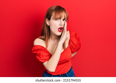 Redhead Young Woman Wearing Casual Red T Shirt Hand On Mouth Telling Secret Rumor, Whispering Malicious Talk Conversation 