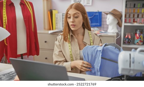 Redheaded woman tailor in atelier inspecting garment quality with sewing machine, fabric, and mannequin - Powered by Shutterstock