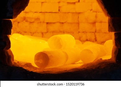 red-hot steel metal billets are heated in a furnace before forging by a blacksmith in a forge. fever heat. metal processing. industrial oven - Powered by Shutterstock