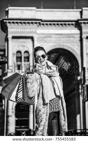 Similar – Blonde thin woman with hat and sunglasses visiting the city during the day.