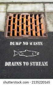 Redmond, WA, USA - March 13, 2022; Dump No Waste - Drains To Stream With Storm Drain And Fish Outline In Downtown Redmond Washington