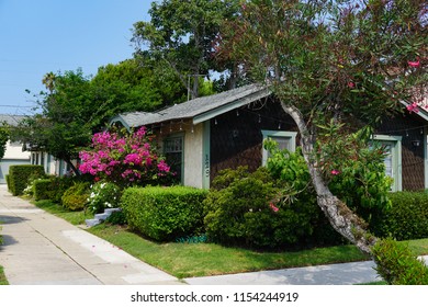 Redondo Beach, California USA - August 10, 2018: A Row Of Craftsman Style Cottages In A Los Angeles Area Bungalow Court With Flowers And Lush Landscaping On South Broadway