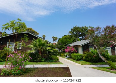 Redondo Beach, California USA - August 10, 2018: Bungalow court of Craftsman style cottages with brown wood shingle and stucco, a good example of a classic Los Angeles apartment architecture