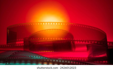 red-orange background with film strip - Powered by Shutterstock