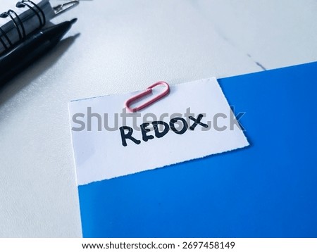 Redox writting on table background.
