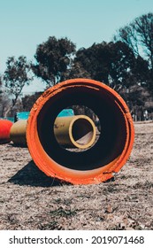 A red-painted large diameter pipe at the construction site
