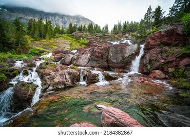 RedRock Falls waterfall in Glacier National Park along the Swiftcurrent Pass trail - Shutterstock ID 2184382867