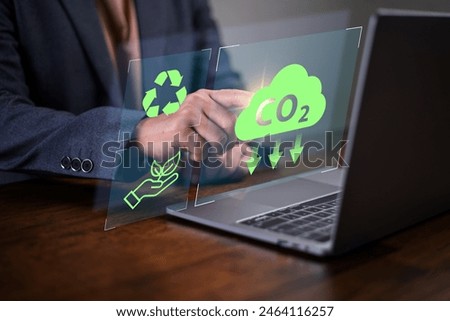 Reduce co2 emission. man using software to lower CO2 emissions to limit global warming and climate change, 
