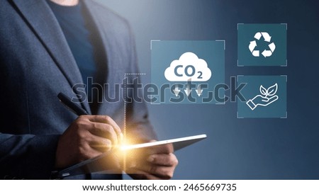 Reduce co2 emission. man using software to lower CO2 emissions to limit global warming and climate change, 