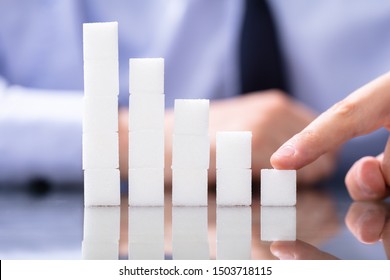 Reduce Sugar Concept. Sugar Cubes In Declining Chart