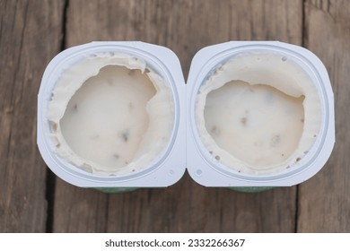 Reducing Food Waste: The Importance of Proper Yogurt Expiration Management concept. - Powered by Shutterstock