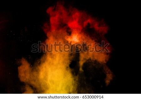 Red-Yellow colorful powder splash on black background