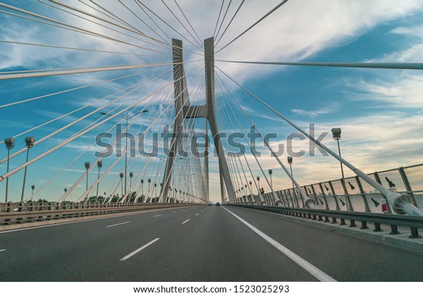 Redzinski\
Bridge in Wroclaw in Poland. Rope bridge on the A8 highway. Highway\
trip. July 4, 2019, Poland Wrocław, A8\
motorway
