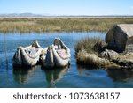 Reed boats at a floating island at lake Titicaca (Peru)