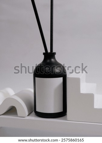 reed diffuser bottle mockup with plain label and minimalist studio scene backgorund