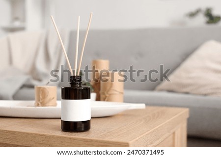 Reed diffuser on table at home, closeup