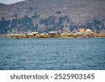 Reed houses at floating islands in puno peru Lake Titicaca