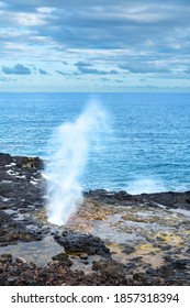 A reef in Kauai Hawaii hosts a blow hole that when swells hit, water spouts out of the hole high into the air. 