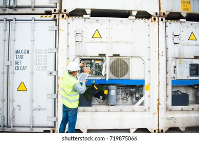 Reefer Container Technician Is Repairing Machinery. 