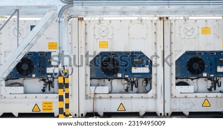 Reefer shipping container engine stacking at the container yard.