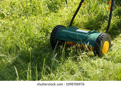 Reel Mower In Actionbackground.