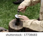 Re-enactment of a actor creating a stone with a hammer