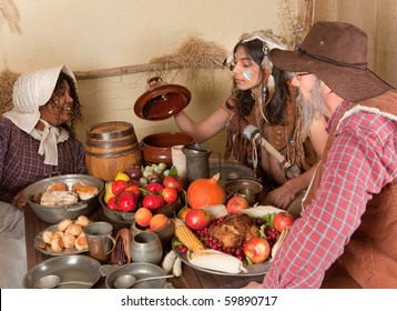 Reenactment Scene Of The First Thanksgiving Dinner In Plymouth In 1621 With A Pilgrim Family And A Wampanoag Indian