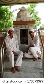 Reengus, Sikar, Rajasthan, India - July 2020: Portrait Shoot Of Rajasthani Men With White Pagadi (turban), Kurta And Pyjama Sitting In Temple