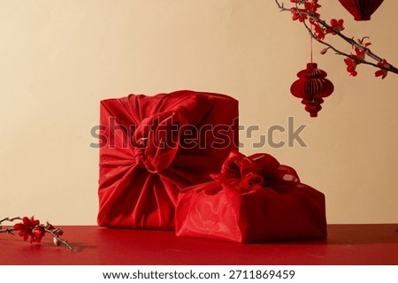 Ref gift boxes with beige background and hanging lanterns. Designed for premium product presentation and Chinese new year promotional materials. Red - beige tone