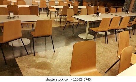 Refectory Empty Table And Chairs.