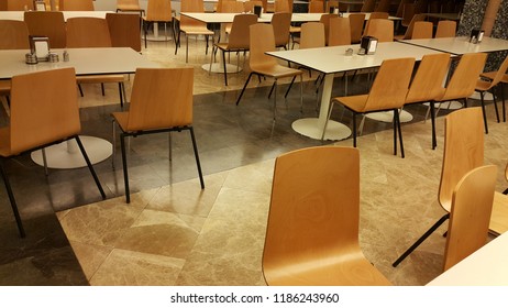 Refectory Empty Table And Chairs.