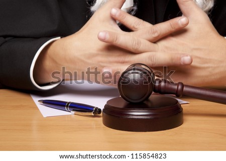 Referee hammer and a man in judicial robes