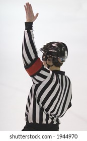 referee making a call in a hockey game
