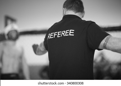 Referee stopping the fight - Powered by Shutterstock