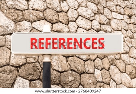 References or reference symbol. Concept word References on beautiful grey road sign. Beautiful stone wall background. Business references or reference concept. Copy space.