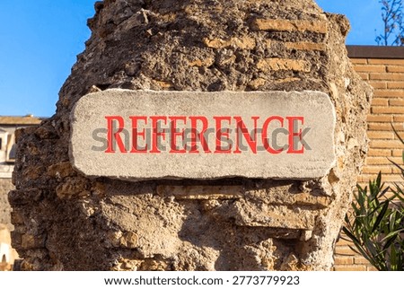 References or reference symbol. Concept word Reference on beautiful white marble sign plate. Beautiful ancient brick wall background. Business references or reference concept. Copy space.
