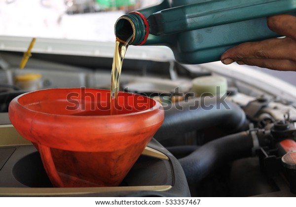Refill lubricant oil\
in to the car engine