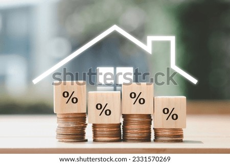 Refinance to reduce the interest of home loan. House icon on background with Percentage sign on wooden block. Mortgage, loan, repayments, credit limit, house tax, business and financial concept.