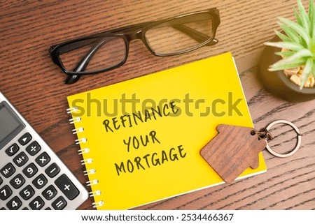 Refinance your mortgage concept. Process of obtaining a new loan to replace an existing home loan, often to secure better terms. Real estate and finance. Notebook, house and calculator on table