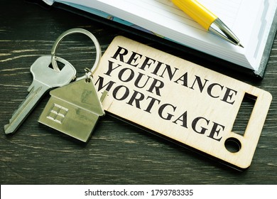 Refinance your mortgage phrase and key with small home. - Shutterstock ID 1793783335