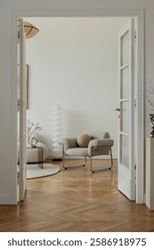 A refined interior setting featuring a boucle lounge chair, warm wood tones, and sculptural decor, merging contemporary style with a soft aesthetic.