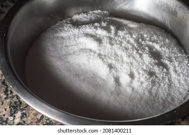 Refined Salt In A Metal Bowl And Dark Background, Copy Space Left