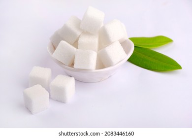 Refined Sugar Cubes On White Background.