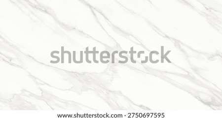 A refined white marble surface featuring soft flowing veins in grey and subtle golden tones. The natural stone pattern creates an elegant and luxurious aesthetic, often associated with premium interiors, architectural surfaces, tiles, counter tops, and sophisticated design backgrounds.