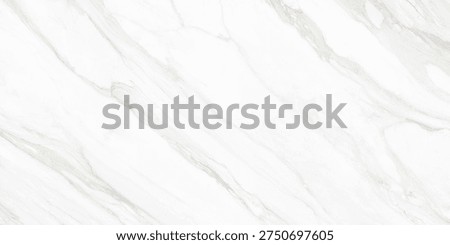 A refined white marble surface featuring soft flowing veins in grey and subtle golden tones. The natural stone pattern creates an elegant and luxurious aesthetic, often associated with premium interiors, architectural surfaces, tiles, counter tops, and sophisticated design backgrounds.