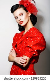 Refinement. Sophisticated Arrogant Woman In Red Polka Dot Dress With Crossed Arms. Fashion. Retro Style - Pin Up