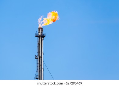 Refinery flare - Burning of dangerous gases in the oil field.